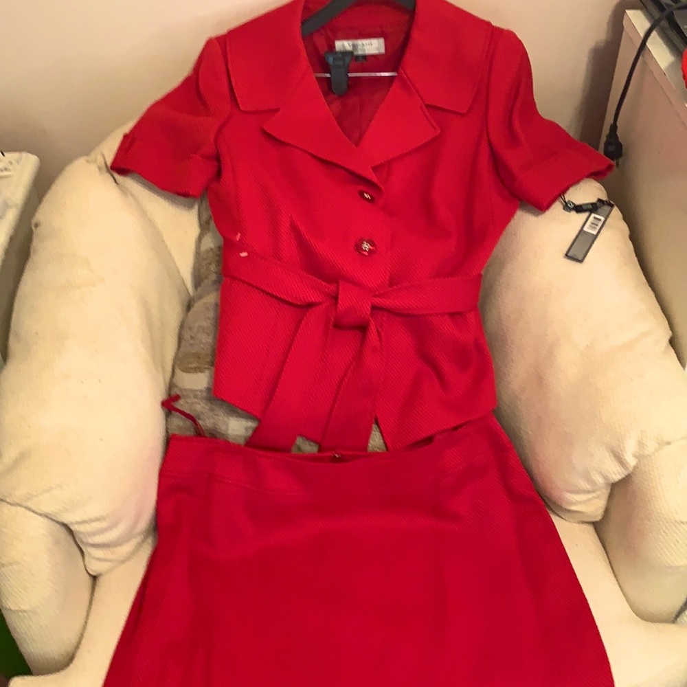 From summer into fall with a cute red skirt suit.